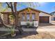 Charming stone and stucco home featuring desert landscaping and a defined house number at 9001 S 18Th Way, Phoenix, AZ 85042
