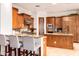 Gourmet kitchen with a breakfast bar, stainless steel appliances, and custom cabinetry at 9001 S 18Th Way, Phoenix, AZ 85042