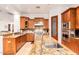 Open-concept kitchen with granite countertops, stainless steel appliances, and a walk-in pantry at 9001 S 18Th Way, Phoenix, AZ 85042