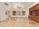 Spacious living area featuring travertine floors, custom built-ins, and an open layout at 9001 S 18Th Way, Phoenix, AZ 85042