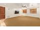 Open living room with large windows and carpet flooring at 9001 S 18Th Way, Phoenix, AZ 85042