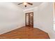 Versatile home office features warm hardwood flooring, natural light, and privacy doors at 9001 S 18Th Way, Phoenix, AZ 85042