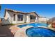 Inviting backyard pool and spa area with brick pavers and well maintained landscaping; perfect for outdoor living at 9001 S 18Th Way, Phoenix, AZ 85042