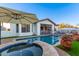 Backyard pool with a pool umbrella and spa at 9001 S 18Th Way, Phoenix, AZ 85042