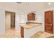 Wet bar with granite counters, wood cabinets, and tile floors at 9001 S 18Th Way, Phoenix, AZ 85042