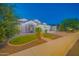 Well-lit home with manicured landscaping and decorative exterior lighting at 9388 W Cashman Dr, Peoria, AZ 85383