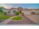 Charming single-Gathering home with a well-manicured front yard, beautiful stone accents, and a spacious two-car garage at 9388 W Cashman Dr, Peoria, AZ 85383