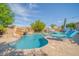 Stunning pool with rock waterfall, lush greenery, and lounge chairs for ultimate relaxation at 9388 W Cashman Dr, Peoria, AZ 85383