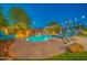 Backyard oasis with a stunning pool, complete with a rock waterfall feature and lounge seating at 9388 W Cashman Dr, Peoria, AZ 85383