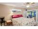 Comfortable bedroom with a window and access to a sunroom at 10303 W Desert Forest N Cir, Sun City, AZ 85351