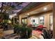 Picturesque backyard with covered patio, lush foliage, and elegant outdoor seating area at 12715 W Crestvale Dr, Peoria, AZ 85383