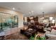 Inviting living room featuring tile floors, neutral walls, modern furnishings, and natural light at 12715 W Crestvale Dr, Peoria, AZ 85383