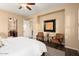 The main bedroom features an ensuite bathroom, two chairs, and a gray rug at 12715 W Crestvale Dr, Peoria, AZ 85383