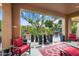 Serene patio with potted plants, comfortable seating, and a tranquil water feature at 12715 W Crestvale Dr, Peoria, AZ 85383