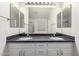 Bathroom featuring a double sink vanity with a granite countertop and ample storage space at 13408 W Mauna Loa Ln, Surprise, AZ 85379