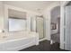 Bathroom features a bathtub, separate shower, and tiled floors that enhance its appeal at 13408 W Mauna Loa Ln, Surprise, AZ 85379