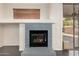 Close-up of the cozy living room fireplace, showing details and design at 13408 W Mauna Loa Ln, Surprise, AZ 85379