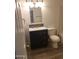 Updated bathroom features modern vanity, decorative mirror, and tiled backsplash at 13839 N 33Rd St, Phoenix, AZ 85032