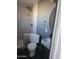 The bathroom features a sleek sink, toilet, and a glass-enclosed shower with elegant tilework at 13839 N 33Rd St, Phoenix, AZ 85032
