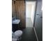 The bathroom showcases a stylish vessel sink, dark tiled floors, and a modern sliding barn door feature at 13839 N 33Rd St, Phoenix, AZ 85032