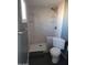 The bathroom showcases a sleek sink, toilet, and a glass-enclosed shower with elegant tilework at 13839 N 33Rd St, Phoenix, AZ 85032