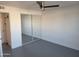 Bright bedroom with painted brick walls, modern ceiling fan, and mirrored closet doors at 13839 N 33Rd St, Phoenix, AZ 85032