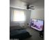 Bedroom with a ceiling fan and a television at 13839 N 33Rd St, Phoenix, AZ 85032