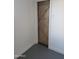 Stylish rustic barn door with wood grain detail and a unique Z pattern adds character to the home at 13839 N 33Rd St, Phoenix, AZ 85032