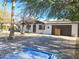 Charming single-story home with a two-car garage, desert landscaping, and a long driveway at 13839 N 33Rd St, Phoenix, AZ 85032