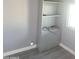 Spare room with a closet with shelves, and gray walls and flooring ready for customization at 13839 N 33Rd St, Phoenix, AZ 85032