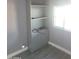 Spare room with a closet with shelves, and gray walls and flooring ready for customization at 13839 N 33Rd St, Phoenix, AZ 85032