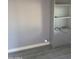 Spare room with a closet with shelves, and gray walls and flooring ready for customization at 13839 N 33Rd St, Phoenix, AZ 85032