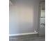Spare room with a closet with shelves, and gray walls and flooring ready for customization at 13839 N 33Rd St, Phoenix, AZ 85032