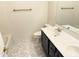 Bathroom featuring dual vanity and modern fixtures at 16823 S 27Th Ave, Phoenix, AZ 85045
