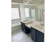 Bathroom with dual vanity and tile floor at 16823 S 27Th Ave, Phoenix, AZ 85045
