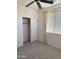 Bedroom featuring carpet, window with blinds, and closet at 16823 S 27Th Ave, Phoenix, AZ 85045