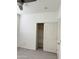 Bedroom showcasing closet with sliding doors and built-in shelving at 16823 S 27Th Ave, Phoenix, AZ 85045