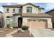 Charming two-story home featuring a neutral color scheme and a well-manicured front yard at 16823 S 27Th Ave, Phoenix, AZ 85045