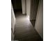Hallway featuring tile flooring with a night light outlet at 16823 S 27Th Ave, Phoenix, AZ 85045