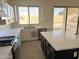 Updated kitchen featuring granite countertops, modern appliances, and a center island at 16823 S 27Th Ave, Phoenix, AZ 85045