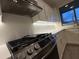 Kitchen with white cabinets and stainless steel range at 16823 S 27Th Ave, Phoenix, AZ 85045