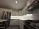 Kitchen with white cabinetry and stainless steel appliances at 16823 S 27Th Ave, Phoenix, AZ 85045