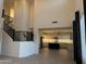 Open-concept living space showcasing high ceilings and view into the modern, bright kitchen at 16823 S 27Th Ave, Phoenix, AZ 85045