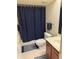 Standard bathroom with shower tub combination, toilet, vanity, and blue accents at 17404 N 99Th Ave # 136, Sun City, AZ 85373