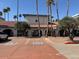 Front exterior of building with handicapped parking and well-maintained landscaping at 17404 N 99Th Ave # 136, Sun City, AZ 85373
