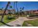 Community grounds with walking path and verdant landscaping at 17404 N 99Th Ave # 136, Sun City, AZ 85373