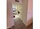 Hallway leading to a bathroom featuring a vanity area at 17404 N 99Th Ave # 136, Sun City, AZ 85373