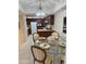 Eat-in kitchen with glass dining table and pendant lighting at 17404 N 99Th Ave # 136, Sun City, AZ 85373