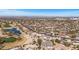 Aerial view of a community with desert landscaping, mature trees, and golf course nearby at 18352 N Diamond Dr, Surprise, AZ 85374