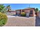 Desert landscaped backyard with covered patio, perfect for relaxing or entertaining at 18474 N Celis St, Maricopa, AZ 85138